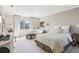 Bedroom with lots of living space, with windows and neutral tones at 10211 Quails Landing Ave, Tampa, FL 33647