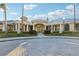 Stunning clubhouse with manicured landscaping and symmetrical design, offering a welcoming entrance at 10211 Quails Landing Ave, Tampa, FL 33647