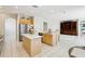 Spacious kitchen boasting stainless steel appliances, a center island, and an open design perfect for entertaining at 10211 Quails Landing Ave, Tampa, FL 33647