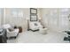 Cozy living room with bright lighting and large windows at 10211 Quails Landing Ave, Tampa, FL 33647