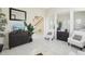 Inviting living room showcasing stylish furnishings, a decorative mirror, and seamless transition to other living spaces at 10211 Quails Landing Ave, Tampa, FL 33647