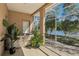 Relax in this screened-in patio with a hot tub and stunning views of the lake at 10211 Quails Landing Ave, Tampa, FL 33647