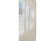 Close-up of interior window with plantation shutters offering privacy and light control at 10211 Quails Landing Ave, Tampa, FL 33647