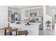 Bright kitchen featuring a large island, stainless steel appliances, and modern cabinetry at 10605 Dusty Boot Rd, Land O Lakes, FL 34638