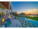 Luxury backyard with a pool, spa, and patio seating areas are perfect for outdoor entertaining and relaxation at 110 Harbor View Ln, Belleair Bluffs, FL 33770