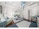 A charming room with a cozy bunk bed and a sitting area for relaxing and reading at 110 Harbor View Ln, Belleair Bluffs, FL 33770