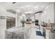 Bright, all-white kitchen with stainless steel appliances and marble countertops at 110 Harbor View Ln, Belleair Bluffs, FL 33770