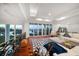 Upstairs living room with water view, balcony, and stylish furnishings at 110 Harbor View Ln, Belleair Bluffs, FL 33770
