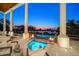 An outdoor patio shows a spa and pool with fire bowls and outdoor seating, perfect for entertaining at 110 Harbor View Ln, Belleair Bluffs, FL 33770