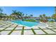 Inviting pool area with comfortable seating and serene waterfront views, perfect for relaxation and entertainment at 110 Harbor View Ln, Belleair Bluffs, FL 33770
