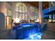 Beautiful spa with a waterfall feature and fire bowls provides a luxurious outdoor living space at 110 Harbor View Ln, Belleair Bluffs, FL 33770