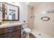 Bathroom with a shower and vanity with a framed mirror at 12025 Environmental Dr # 5, New Port Richey, FL 34654