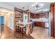Modern kitchen with stainless steel appliances and bar seating with unique wood facade at 12025 Environmental Dr # 5, New Port Richey, FL 34654