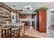 Modern kitchen features wood accents, stainless appliances and a stylish breakfast bar with seating at 12025 Environmental Dr # 5, New Port Richey, FL 34654