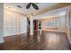 Spacious living room featuring hardwood floors and a ceiling fan at 12025 Environmental Dr # 5, New Port Richey, FL 34654