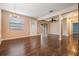 Bright living room with wood floors, fan, and sliding door access at 12025 Environmental Dr # 5, New Port Richey, FL 34654