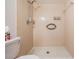 Bathroom with a shower featuring tile surround at 12025 Environmental Dr # 5, New Port Richey, FL 34654