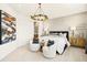 Stylish bedroom features accent wall, accent lighting, and modern decor at 12785 Jade Empress Loop # 202, Venice, FL 34293