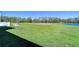 The backyard blends into a scenic park with a winding path and a charming water feature at 1291 Colt Creek Pl, Wesley Chapel, FL 33543