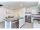 Contemporary kitchen featuring granite countertops, stainless steel appliances, and an island open to dining at 1291 Colt Creek Pl, Wesley Chapel, FL 33543