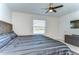 Comfortable main bedroom with ceiling fan and window, offering a relaxing retreat for rest and relaxation at 1291 Colt Creek Pl, Wesley Chapel, FL 33543