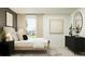 Bedroom showcasing coordinated decor, a comfortable bed, and natural light for a relaxing retreat at 13043 Calcite Blue Ave, Wimauma, FL 33598