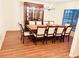 Traditional dining room featuring a wood table with seating for ten and a decorative china cabinet at 15013 Redcliff Dr, Tampa, FL 33625