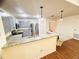 Bright kitchen features granite countertops, stainless steel appliances, and pendant lighting for a modern feel at 15013 Redcliff Dr, Tampa, FL 33625