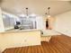 Open concept kitchen features granite countertops, stainless steel appliances and breakfast bar seating at 15013 Redcliff Dr, Tampa, FL 33625