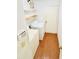 Laundry room with full size washer and dryer, shelving and access door at 15013 Redcliff Dr, Tampa, FL 33625