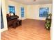 Spacious living room featuring windows, hard wood floors, and plenty of room to entertain at 15013 Redcliff Dr, Tampa, FL 33625
