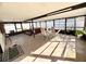 Enclosed sunroom with a hot tub and seating area, ideal for year-round relaxation and entertainment at 15013 Redcliff Dr, Tampa, FL 33625