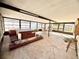 Relaxing sunroom featuring a hot tub, seating area, and tiled floors for year-round enjoyment at 15013 Redcliff Dr, Tampa, FL 33625