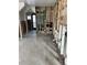 Open-concept kitchen area showcasing stud framing with plumbing and electrical, a blank canvas for renovation at 1751 Massachusetts Ne Ave, St Petersburg, FL 33703