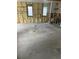 A spacious living room area featuring stud framing and insulation ready for customization and design ideas at 1751 Massachusetts Ne Ave, St Petersburg, FL 33703
