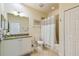 Bright bathroom with tiled floors, vanity with granite countertop, and a shower-tub combination at 2253 Oakley Green Dr # 26, Sun City Center, FL 33573