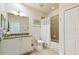 Bright bathroom with tiled floors, vanity with granite countertop, and a shower-tub combination at 2253 Oakley Green Dr # 26, Sun City Center, FL 33573