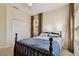 Cozy bedroom with a bed, large window with curtains, and a closet at 2253 Oakley Green Dr # 26, Sun City Center, FL 33573