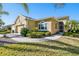 A charming, single story home showcasing well-kept landscaping and a welcoming walkway to the front door at 2253 Oakley Green Dr # 26, Sun City Center, FL 33573