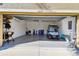 Bright garage containing a golf cart and plenty of extra storage and space for tools at 2253 Oakley Green Dr # 26, Sun City Center, FL 33573