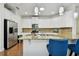 Modern kitchen featuring granite countertops, stainless appliances and a central island, perfect for entertaining and meal preparation at 2253 Oakley Green Dr # 26, Sun City Center, FL 33573