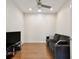 This living room features hardwood floors, recessed lighting, and a dark couch at 2253 Oakley Green Dr # 26, Sun City Center, FL 33573