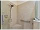Neat shower featuring a shower head, a grab bar, and a built-in seat for safety and convenience at 2253 Oakley Green Dr # 26, Sun City Center, FL 33573