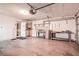 Spacious garage with overhead door, pegboard storage system, and ample workspace at 2457 Orangepointe Ave, Palm Harbor, FL 34683