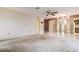 Large open-concept living room featuring carpet flooring, tile flooring, and a view to the kitchen at 2457 Orangepointe Ave, Palm Harbor, FL 34683