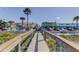 Boardwalk leading to beachfront with colorful shops and restaurants, perfect for leisure and dining at 2605 Pass A Grille Way, St Pete Beach, FL 33706