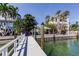 Property features a private dock and charming gazebo, ideal for relaxation and enjoying the waterfront at 2605 Pass A Grille Way, St Pete Beach, FL 33706