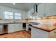 Bright kitchen with stainless steel appliances and unique countertop at 2605 Pass A Grille Way, St Pete Beach, FL 33706