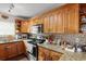 Modern kitchen featuring wooden cabinets and stainless steel appliances at 2626 36Th N Ave, St Petersburg, FL 33713