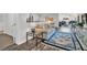 Cozy living area showcasing an open layout connecting the kitchen and dining spaces at 2873 Doone Cir, Palm Harbor, FL 34684